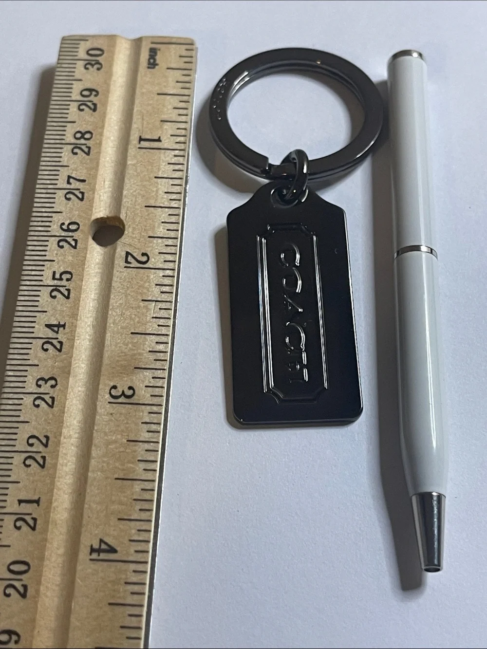 Coach Gunmetal Key Tag With White Coach Pen